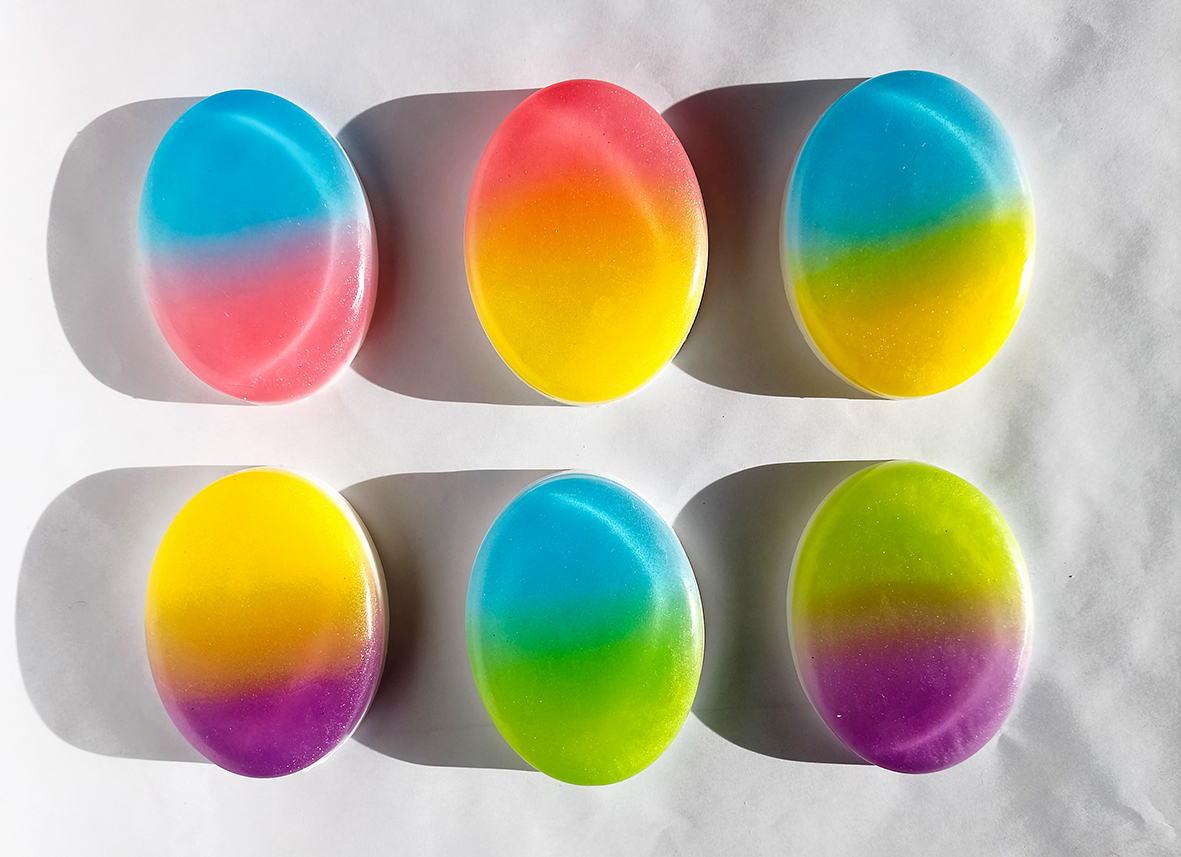 Ombré soap in six pieces is neatly arranged and placed on a white background.